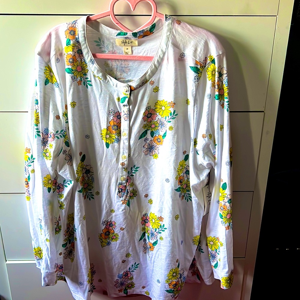 Plus size women’s white floral print long sleeve blouse.
